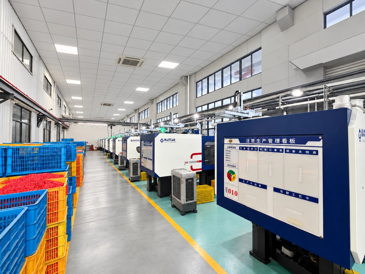 Injection moulding line with a control unit and storage crates